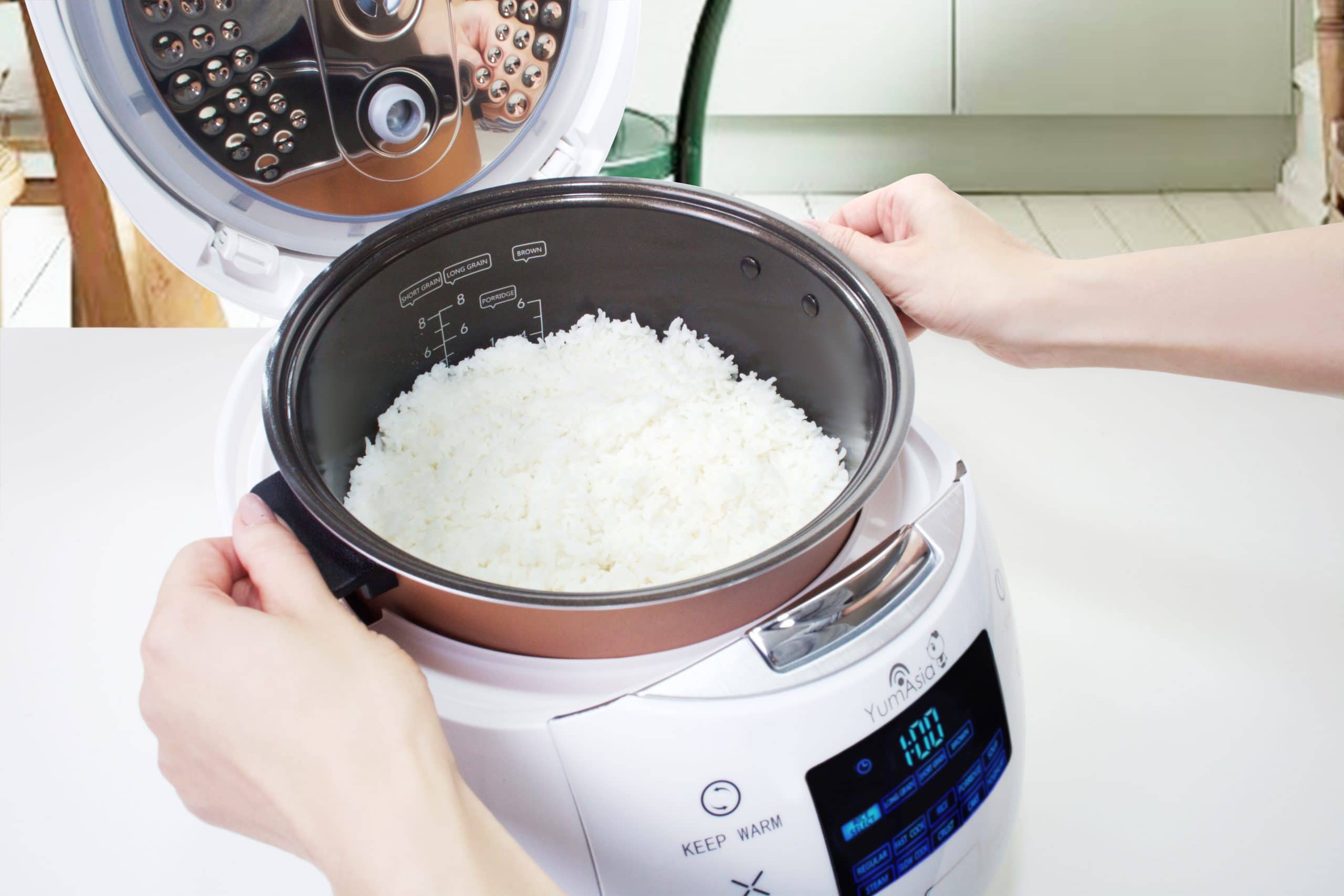 The inner bowls of a rice cooker - GreedyPanda Foodie Blog