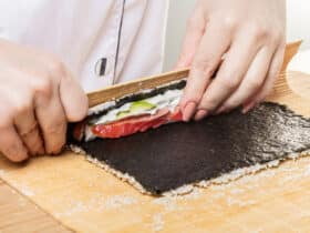 Chef prepares rolls, hands closeup