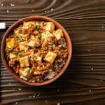 Flat lay view at mapo tofu dish with pork chives steamed rice an