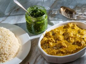 Authentic Indian almond chicken korma curry dinner with basmati rice and green chutney