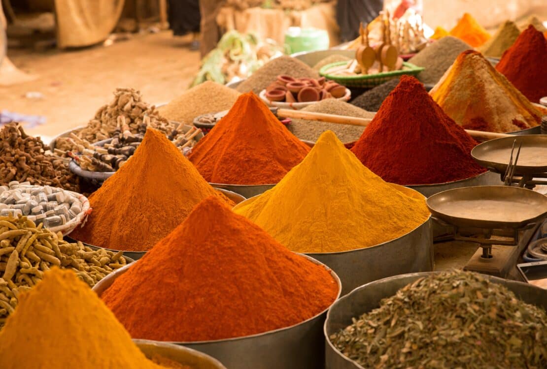 A closeup shot of colorful Asian spices in the market with a blurry background