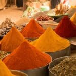 A closeup shot of colorful Asian spices in the market with a blurry background