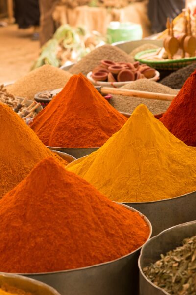 A closeup shot of colorful Asian spices in the market with a blurry background