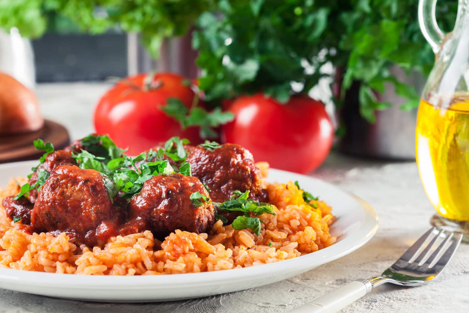 Meatballs with tomato sauce and red rice. Spanish and Mexican dish