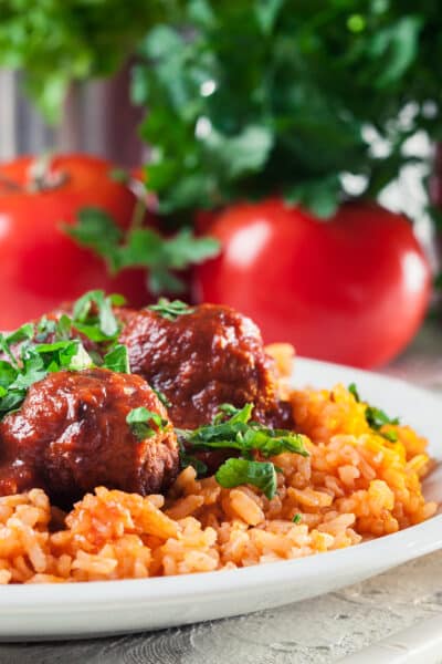 Meatballs with tomato sauce and red rice. Spanish and Mexican dish