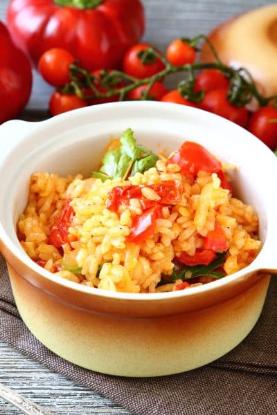 Rice with vegetables in a pot, food close up