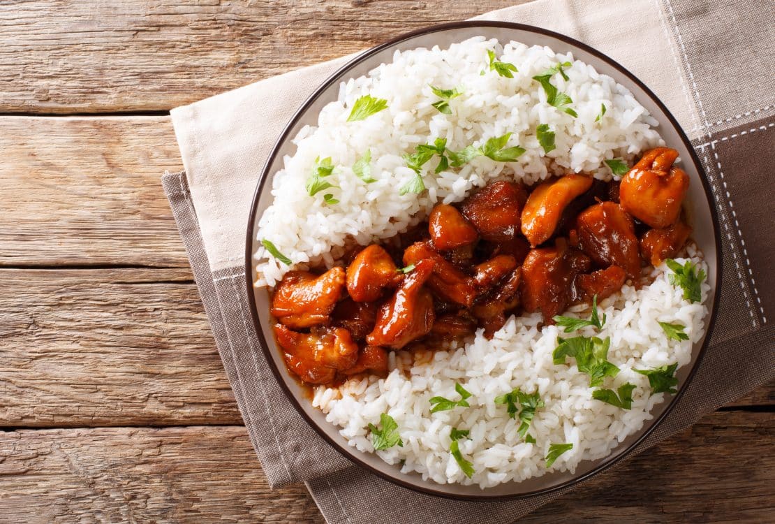 Stewed Bourbon chicken in sauce with whiskey, sugar, ginger and