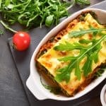 top down view of vegetable lasagne with rocket salad garnish 14493