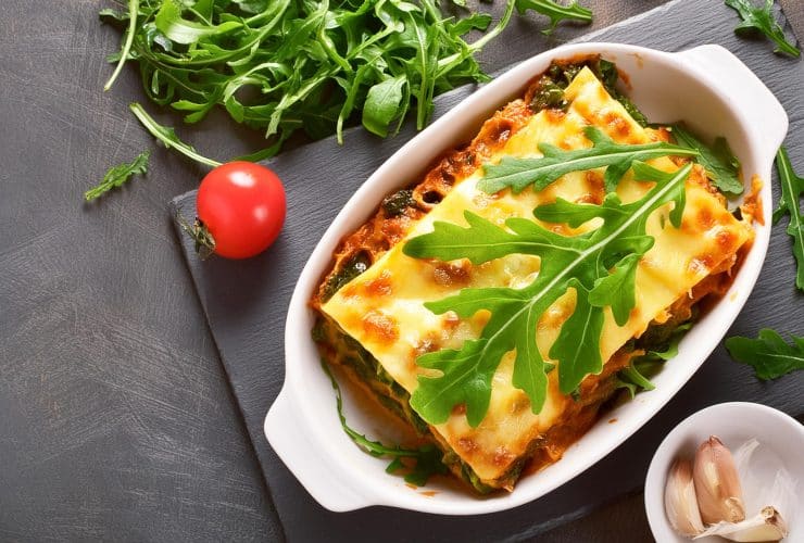 top down view of vegetable lasagne with rocket salad garnish 14493